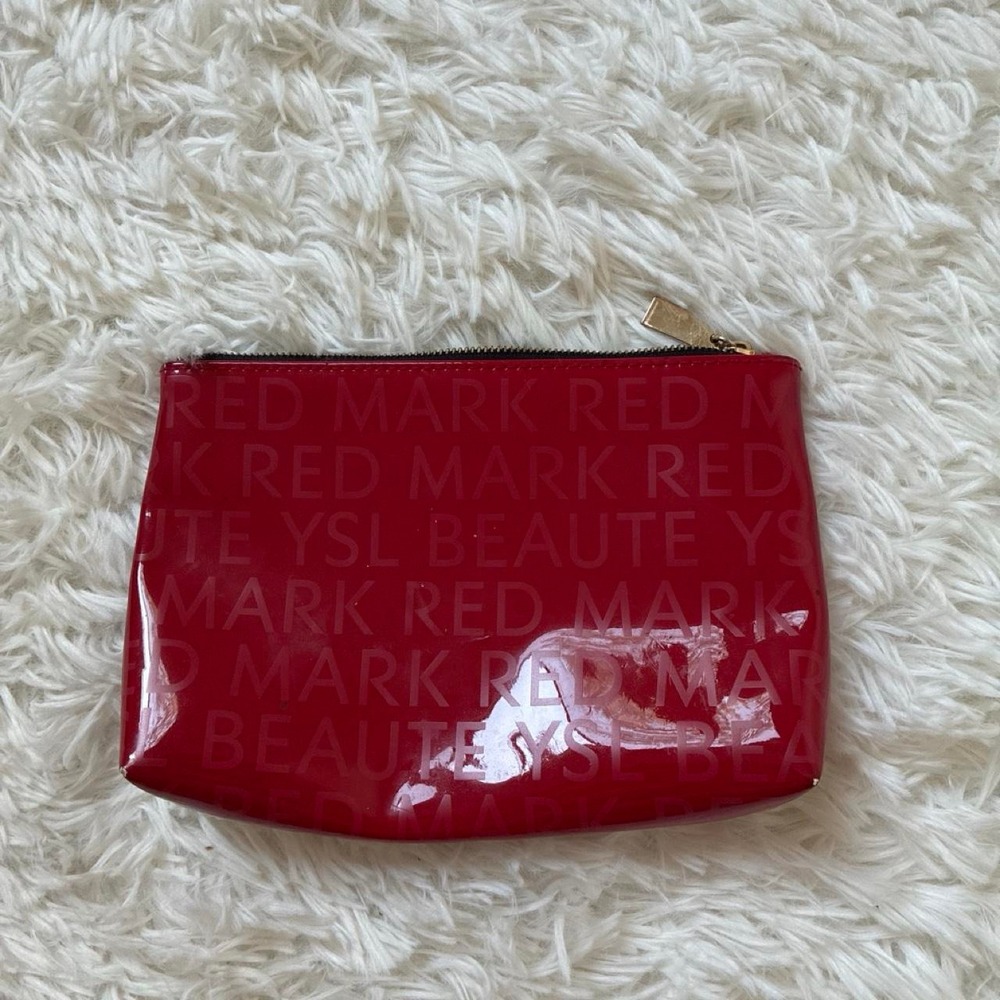 YSL red small makeup pouch with repeating text pattern